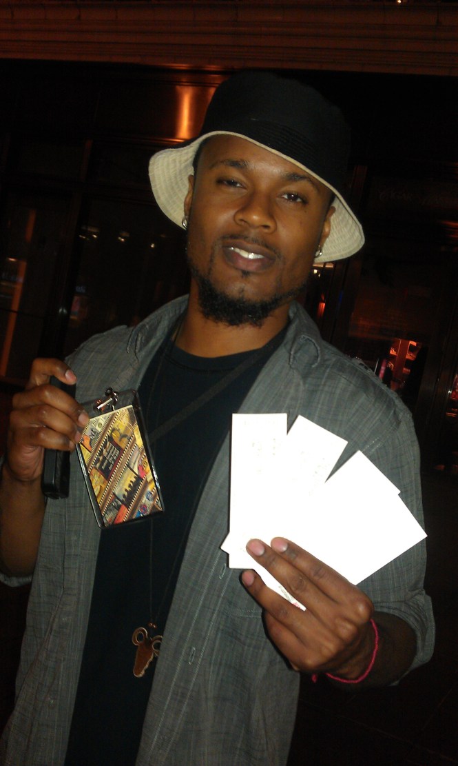 Co Producer Hakim Hill holding "Step Up" official tickets 