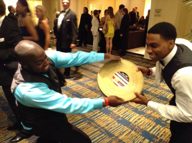 Director Noube Rateau and Anthony Goss having fun with the newest award 